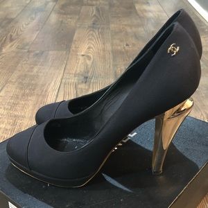 Chanel black pumps fit like US size 10